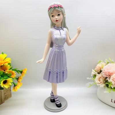 China Fashionable Creative China Wearing Purple Dress With Beautiful Garland Girl Resin Opens Home Furnishing Gift Souvenir for sale