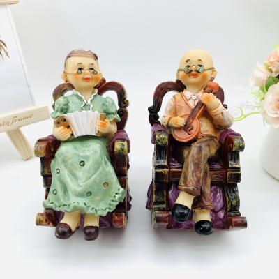 China Europe creative resin crafts middle aged leisure rocking chair old man couples furnishing articles wedding gift for sale