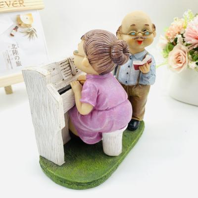 China Europe resin creative crafts play the piano old man couples elder furnishing articles the wedding gift for sale