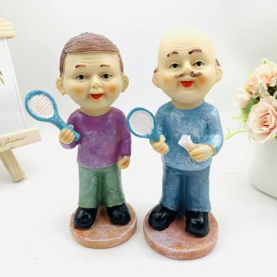 China Europe creative resin open game badminton old man leisure couples elderly furnishing articles wedding gift for sale