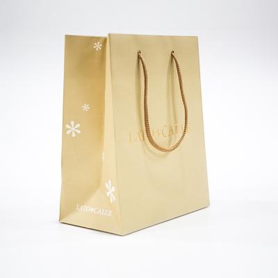 China Eco Friendly Recycled Materials Kraft Paper Clothing Shopping Gift Custom Luxury Cosmetic Packaging Paper Bags for sale