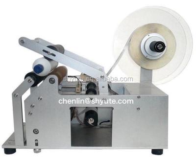 China CLOTHING Semi-auto Manual Labeling Machine For Round Bottles Shanghai for sale