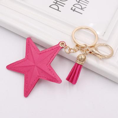 China New Small High Quality Creative Star Pentagon Leather Tassel Pendant Chain Car Mobile Phone Bag Key Chain Pendant for sale