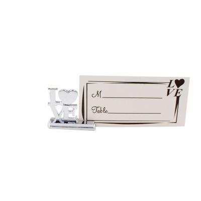 China Wedding Gifts European and American Europe Wedding Supplies Creative Love Metal Seat Card Clip Wedding Card Clip Business Card Holder for sale