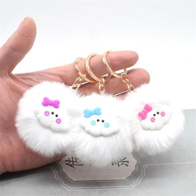 China Industry Wholesale Portable Beautiful Bow Hair Ball Cloud Hair Ball Mobile Phone Bag Smile Key Chain Pendant High Quality for sale