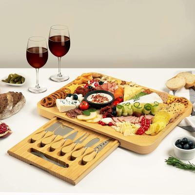 China Simple Sustainable Best Quality Natural Cutting Board Tray With Knife Set Modern Design Bamboo Cheese Meat for sale