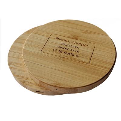 China Conveient Safe High Quality Portable Ultrathin Customize Logo Wireless Phone Charging Wood Qi Portable Bamboo Charger Stand For Mobile Phone for sale