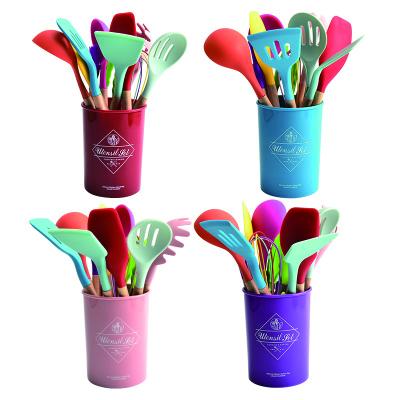 China Sustainable Colorful Wooden Handles 11Pcs Kitchen Silicone Utensil Set With Storage Bucket for sale