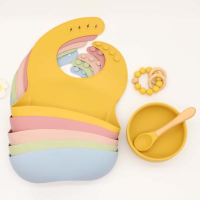 China Four-Piece Suit Durable Fixed Heat Resistant Anti-scald Food Grade Baby Toy Silicone Bib Bowl Spoon Set for sale