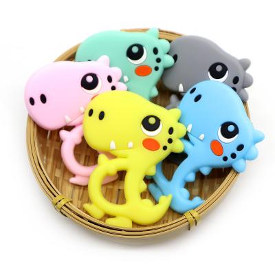 China Soft Toy Unique Design Hot Sale Dinosaur Shape Food Grade Silicone Chewable Baby Teethers for sale