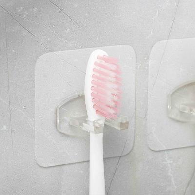 China Stocked Toothbrush Holder hook Self Adhesive Shaver Razor Holder silicone hook Removable Toothbrush Holder Transparent Toothbrush hook for sale