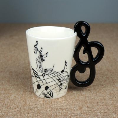 China 3D Product Disposable Hot Unique Guitar Tarpul 210ml Music Mug Ceramic Mug With Lovely Handle for sale