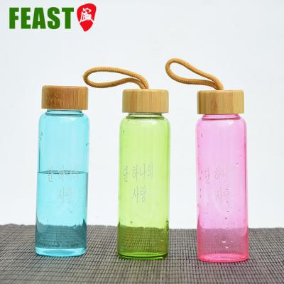 China Sustainable Drinking Water Glass Bottles Sports Bottle Wide Mouth With Wooden Lid Water Bottle Glass for sale