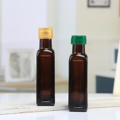 China Wholesale 100ml Brown Olive Oil Glass Transparent Oil Bottle Packing Contains Lid for sale