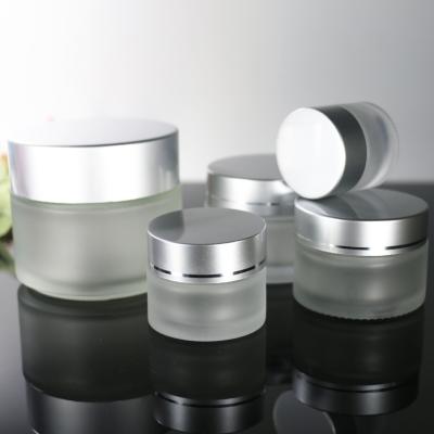 China Personal Care 5g 10g 15g 30g 50g 100g Clear Frosted Glass Cosmetic Jar For Cream Lip Balm for sale