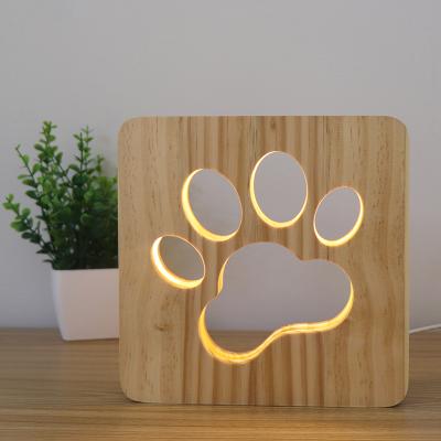 China 2021 Modern Wooden Cavity Paw Mood Light Pine Carved Lamp Kids Solid Wood Led Night Light for sale