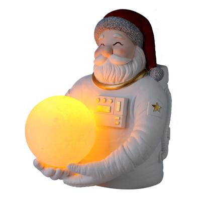 China 2021 New Europe Design Resin Father Christmas Astronaut Sculpture Home Decoration Opens Santa Claus Statue For Christmas Gift for sale