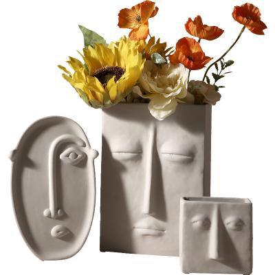 China Europe 2021 Ceramic C face ceramic flower vases pot statue vases in mold sculpture hotel handmade home decor for sale