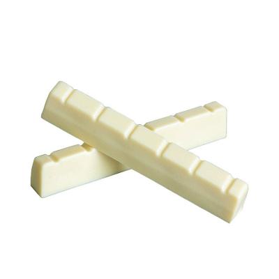 China GUITAR factory wholesale ABS nut and saddle for guitar plastic material classic ivory color for sale