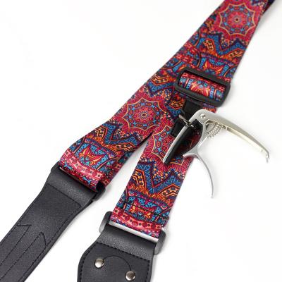 China GUITAR factory supply patterned print folk and electric guitar strap with superfine leather pick and capo slot PU headstock for sale