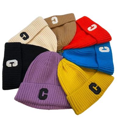 China breathable & Handmade Fashion Warm Waterproof Knit Winter Hats Outdoor Casual Street Curved Letter Hearing Protection Knitted Warm Hat for sale