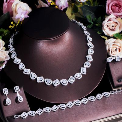 China 2022 Religious Popular Bridal Cubic Zirconia Set Chain Necklace Bracelet Earrings Ring Four-Piece Set Knot Wedding Accessories for sale