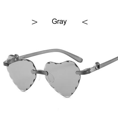 China 2021 New Heart Love Heart Girls Gradient Children's Rimless Sunglasses LEIEN Wholesale for sale