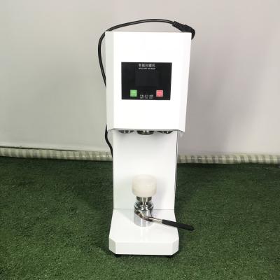 中国 manual beer can seamer soda can plastic bottle cap sealing machine 販売のため