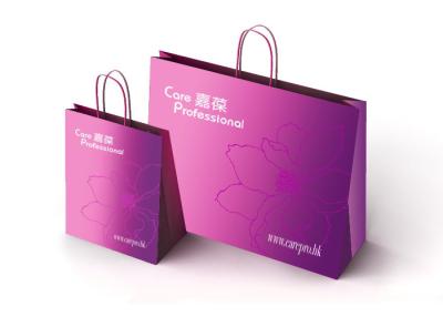 China El lujo durable lleva los bolsos de compras de papel para el peso pesado del asimiento del regalo en venta