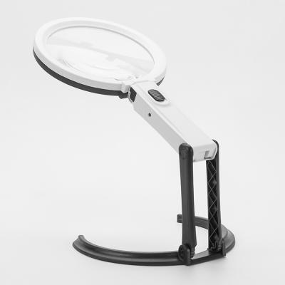 China +ABS Acrylic Lighting Handheld Desk Folding Table Lamp with 12 LED Lighting Bench Magnifier Glass EU US Power Charger for sale