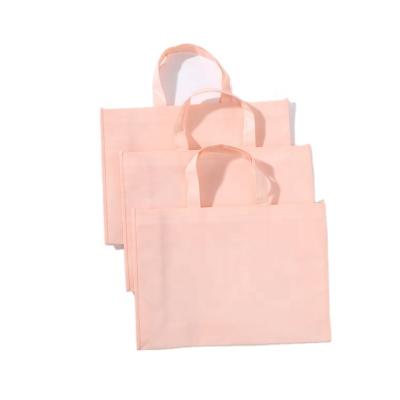 China Pink Eco - Friendly Non Woven Bag For Shopping Custom Shopping Bags 2021 Merry Christmas Logos Customizable for sale