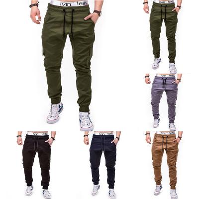 China Anti-Static Mens Fashion Solid Color Casual Side Pockets Tied Belt Drawstring Pants Modern Mens Cargo Pants for sale