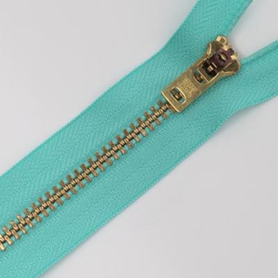 China YKK Zipper Custom metal light gold teeth colorful brand pullers zipper with semi-lock slider for jeans pants trousers for sale