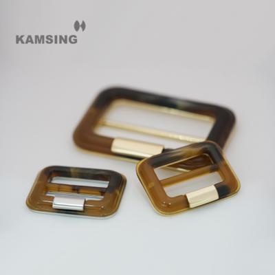 China The Kamsing-New Style Nickel Free Custom Design Elegant Metal Belt Buckle Decoration Garment Plastic Resin Buckle For Clothing for sale