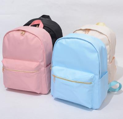 China New Light Pink Customizable Large Capacity Waterproof Candy Color Casual Macaron Bag Storage Travel Logo Ladies Backpack for sale