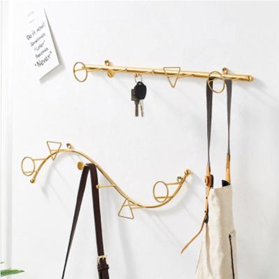 China Modern Lightweight Luxury Customized Viable Art Storage Wall Hanging Hook Iron Clothes Rack Decoration for sale