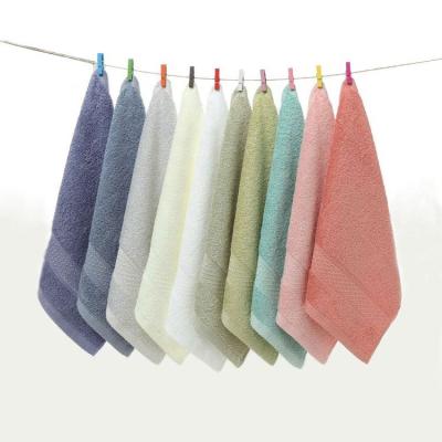 China factory wholesale 100 cotton hot selling colorful solid plain face wash hand towel logo can be customized for sale