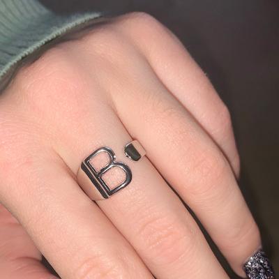 China Vintage 2 Colors Cavity A-Z Letter Stainless Steel Adjustable Opening Ring Name Alphabet Female Party Chunky Initial Jewelry for sale