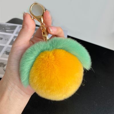 China Plush Rabbit Fur Key Chain Car Key Phone Bag Ornaments Peach Shape Fur Key Chain for sale