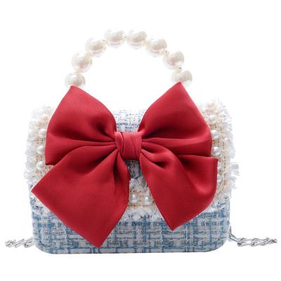 China Fashion Kids Girls Bag With Pearl Handle Cute Bow Tie Girls Shoulder Bag for sale