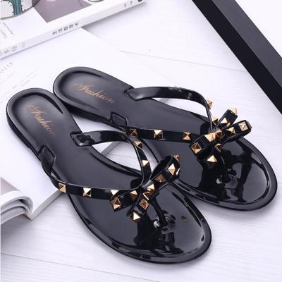 China Summer Jelly Beach Ladies Customized Outdoor Fashion Trend PVC Rivet Slippers Women Shoes Slippers and Sandals Wholesale Flip Flops for sale