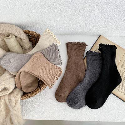 China QUICK DRY Korean winter cashmere wool thick thermal women ruffles socks to shape solid color warm wool thongs women for sale