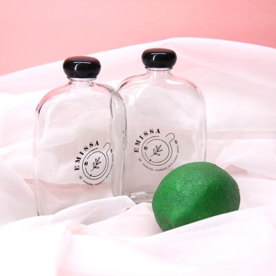 China Eco-friendly In Stock Factory Selling Transparent Flat Empty Milk Juice Beverage Glass Bottle for sale