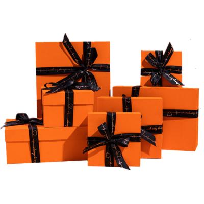 China Beautiful Handmade Rigid Orange Gift Box Sets Cosmetic Lipsticks Shoe Clothing Paper Cardboard Packaging Gift Box With Ribbon Decoration for sale