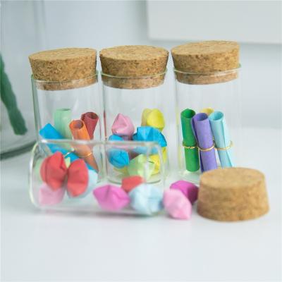 China Gift 20ml Mini Glass Bottles With Corks Tiny Empty Glass 20cc Vial Jars Company Logo Printed Customized Bottles Jars for sale