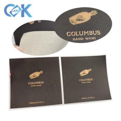 China Custom Anti-Counterfeit Self Adhesive Label Logo Bottle Sticker Gold Foil Embossed Wine Label for sale