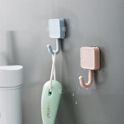 China Japanese Household Kitchen Bathroom Single Sticky Free Wall Hook Strong Plastic Stocked Punch Hook Cheap Hook for sale