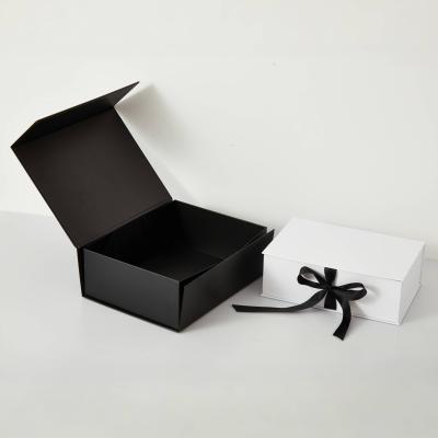 China Custom Clothing Folding Gift Box With Ribbon Magnetic Rigid Boxes for Dresses for sale