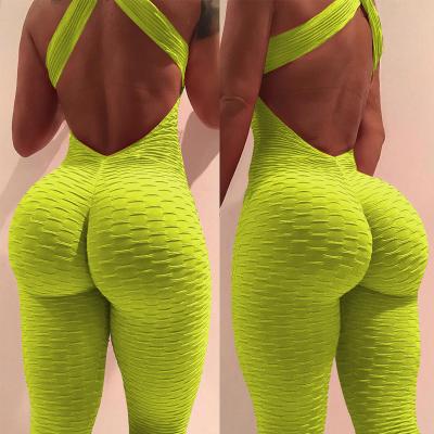 China 2021 Autumn solid color breathable jumpsuit women cross back honeycomb sandwich bubble butt lift yoga jumpsuit wholesale for sale