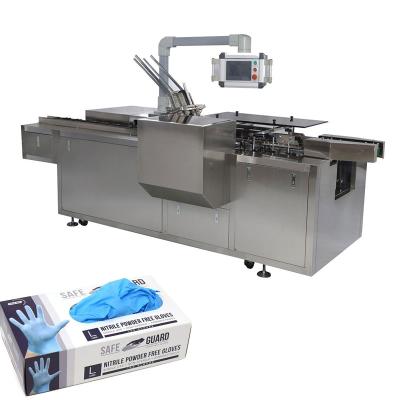 China 100 Pcs N95 Face Mask Packing Machine High Level High Speed ​​Automatic Carton Box Sheet Mask Packing Machine for sale